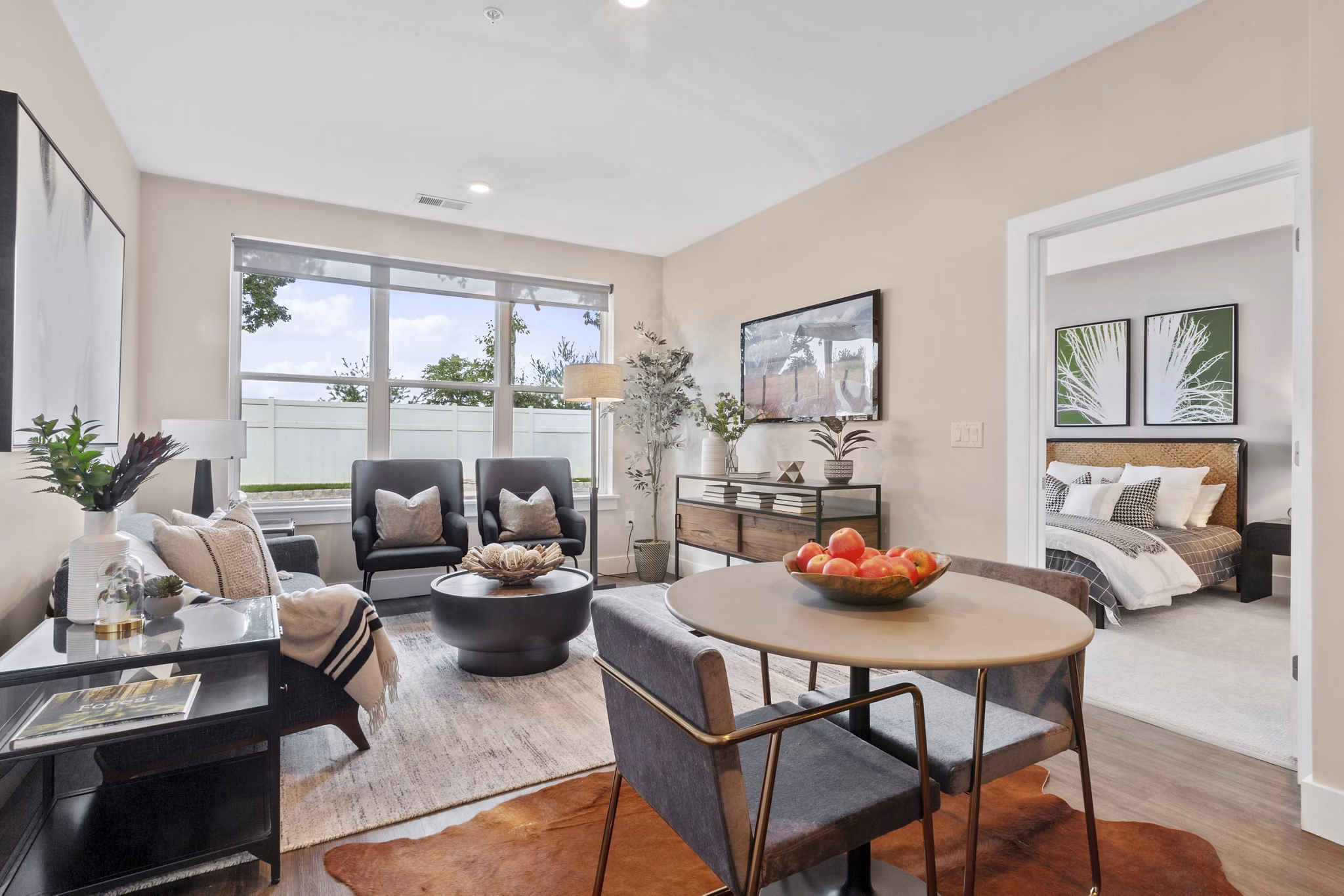 Dining area featuring modern furnishings and art in Canter Green Apartments' luxury setting