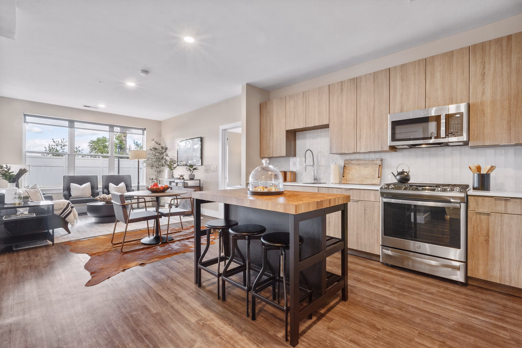 Modern kitchen with stainless steel appliances at Canter Green Apartments