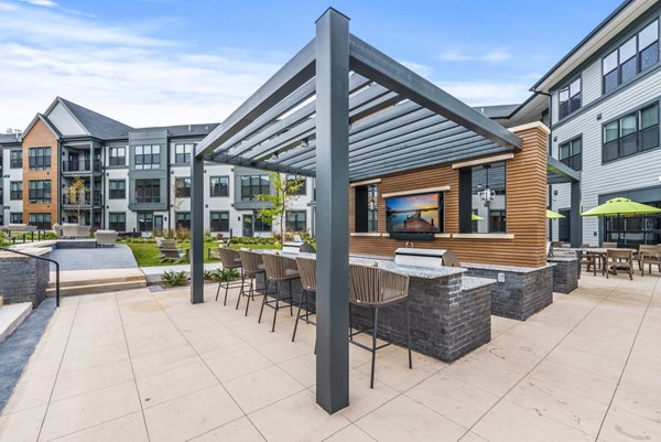 Grill area patio with modern seating at Canter Green Apartments, luxury living spaces ideal for social gatherings