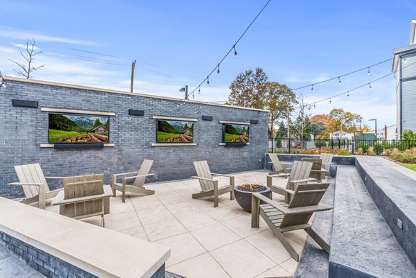 Fire pit area with cozy seating at Canter Green Apartments, perfect for social gatherings and relaxation