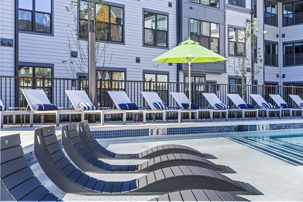 Outdoor pool patio with comfortable seating at Canter Green Apartments