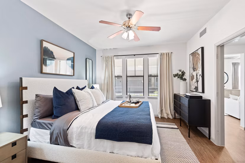 Luxurious bedroom with stylish decor in Creekside Townhomes Apartments