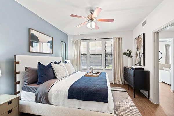 Luxurious bedroom with stylish decor in Creekside Townhomes Apartments