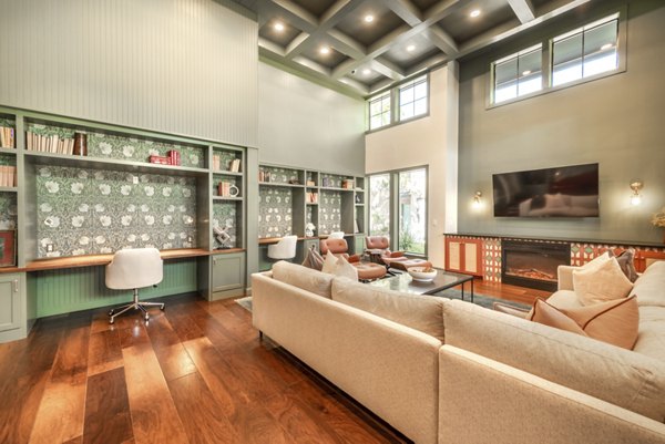 Clubhouse featuring modern design and cozy seating in Creekside Townhomes Apartments