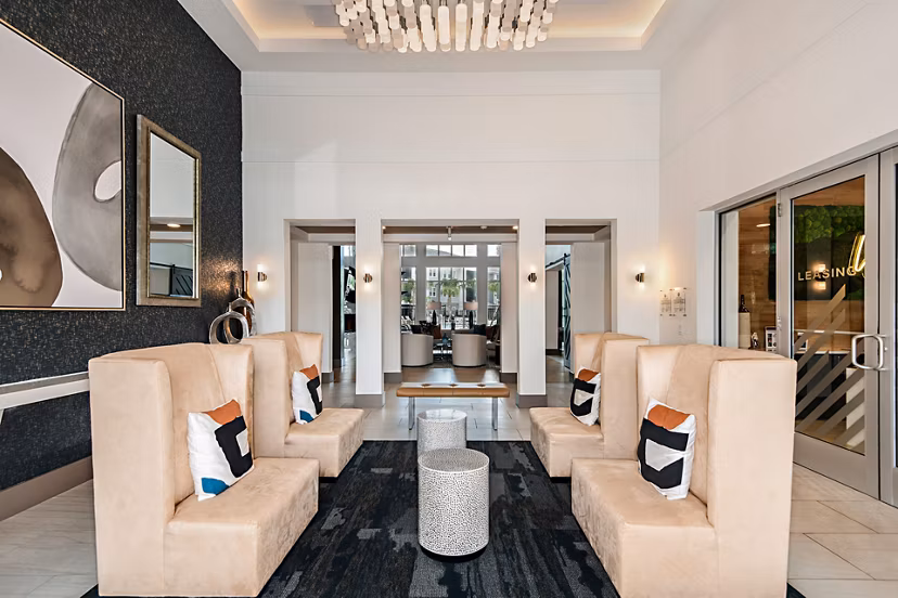 Clubhouse featuring modern seating and billiards table at Encore Metro at Millenia Apartments, ideal for social gatherings and relaxation