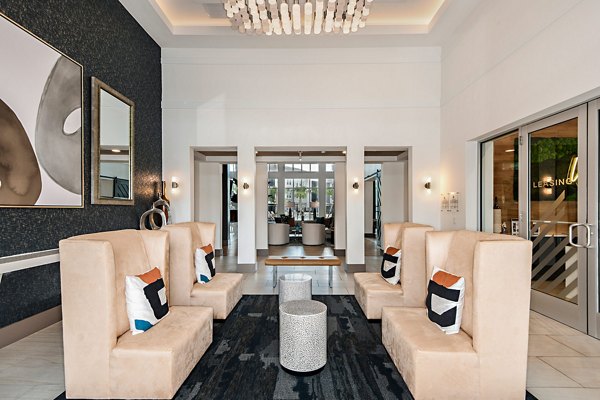 Clubhouse featuring modern seating and billiards table at Encore Metro at Millenia Apartments, ideal for social gatherings and relaxation