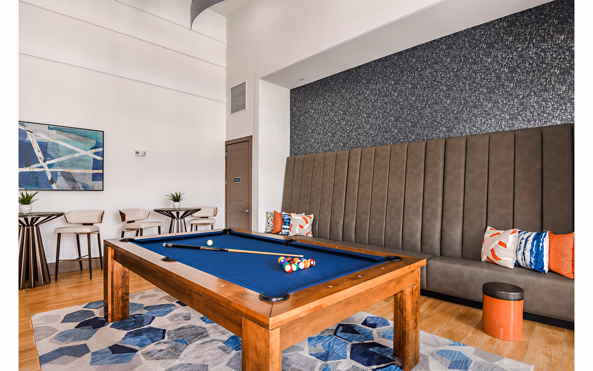 Clubhouse game room featuring pool table and cozy seating at Encore Metro at Millenia Apartments
