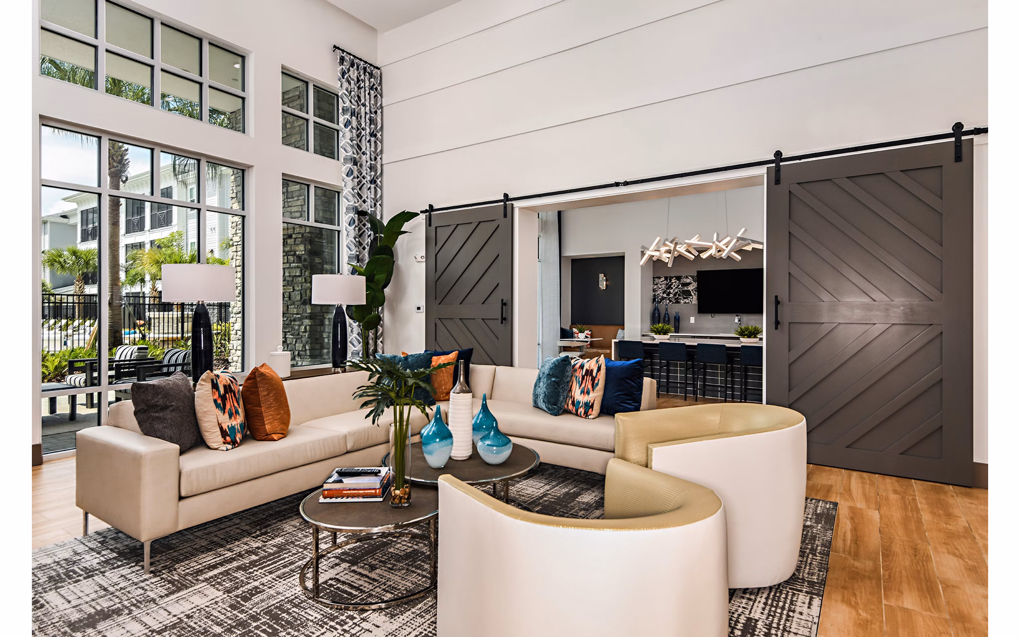 Modern clubhouse with stylish seating and decor at Encore Metro at Millenia Apartments, perfect for social gatherings and events