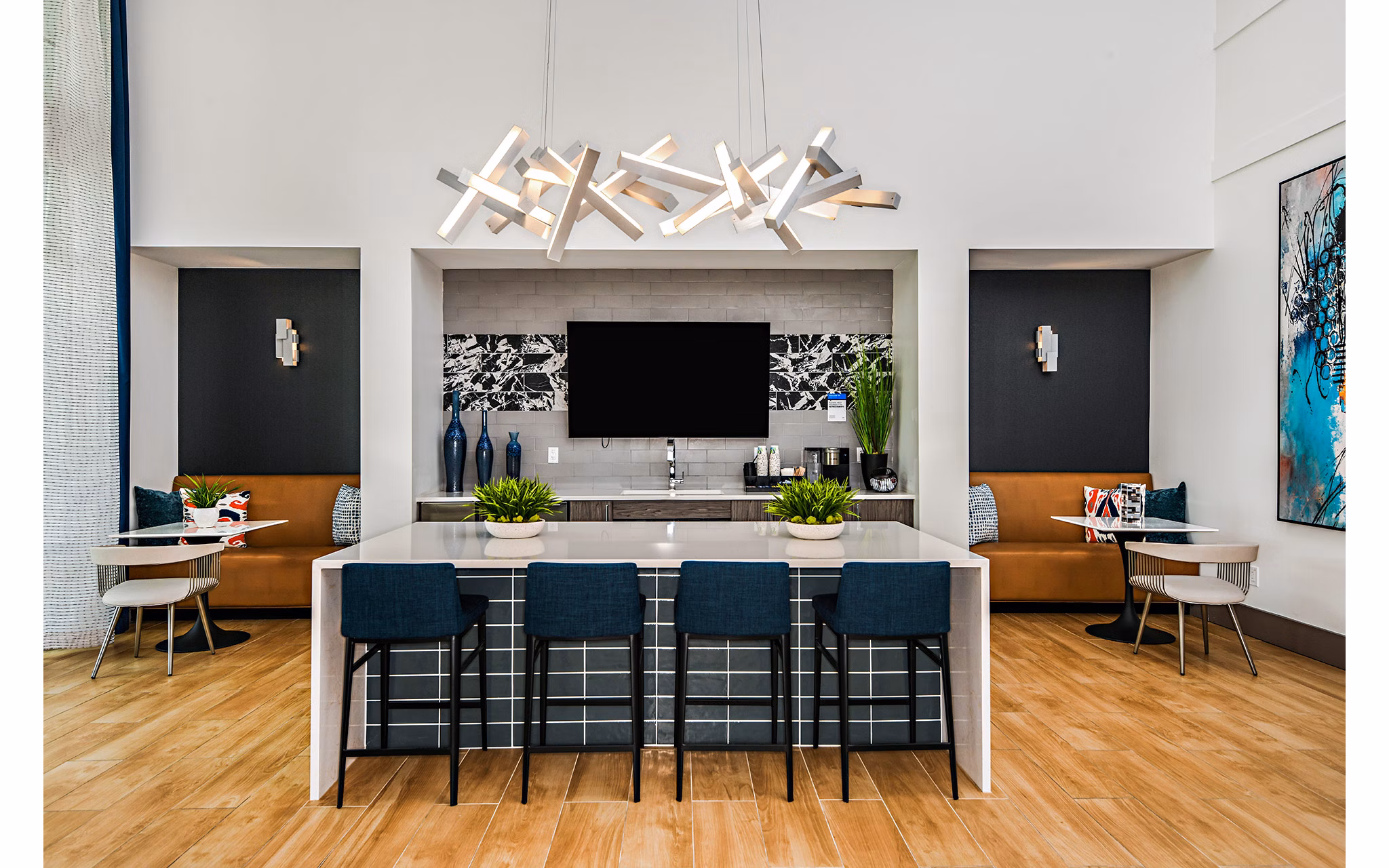 Elegant clubhouse at Encore Metro at Millenia Apartments with plush seating and modern decor, perfect for relaxation and social gatherings
