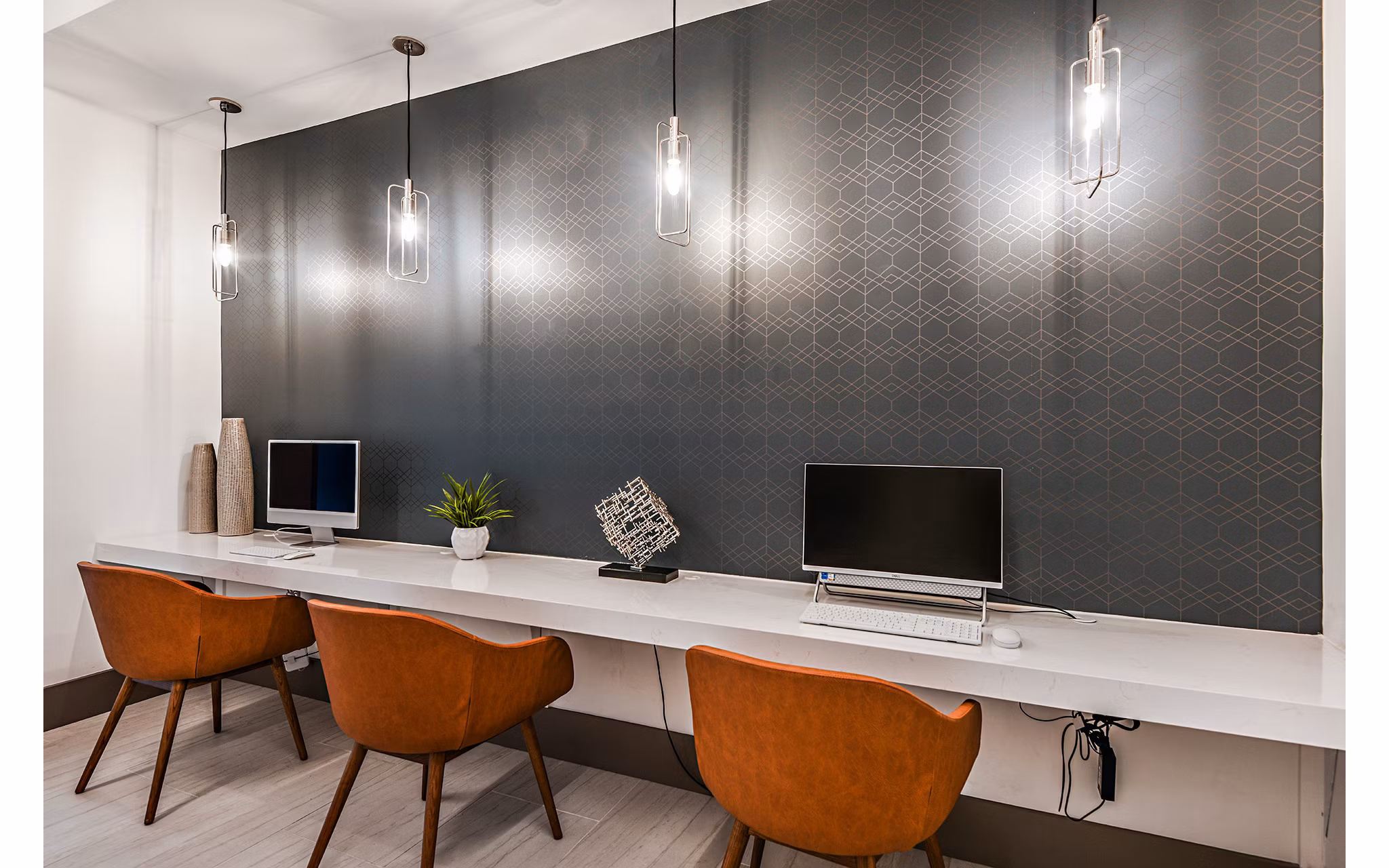 Clubhouse business center with modern workstations at Encore Metro at Millenia Apartments