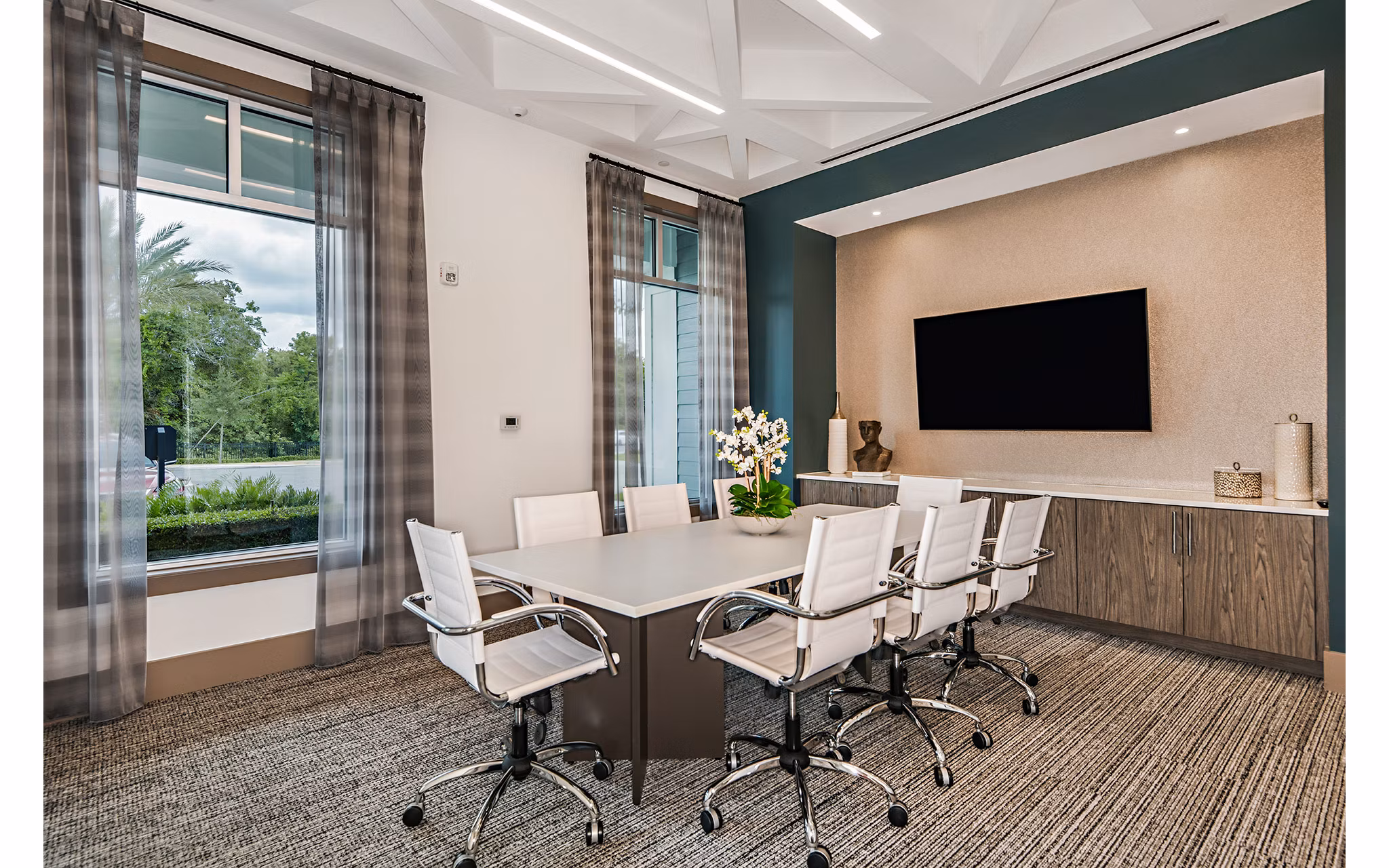 Spacious clubhouse meeting facility featuring modern decor at Encore Metro at Millenia Apartments, ideal for gatherings and events