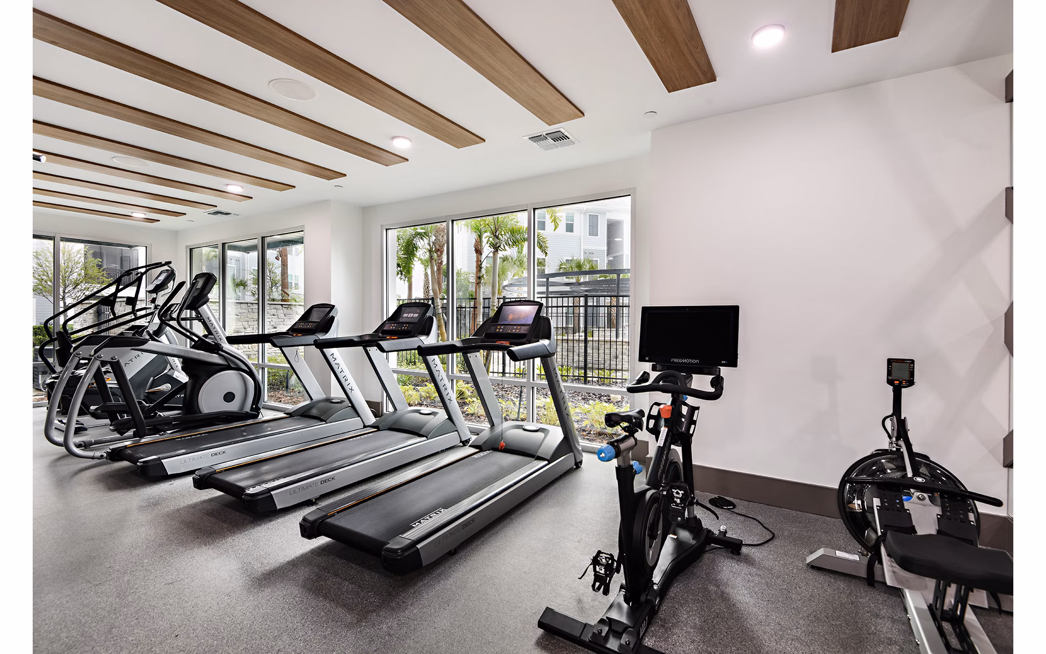 Modern fitness center with state-of-the-art equipment at Encore Metro at Millenia Apartments