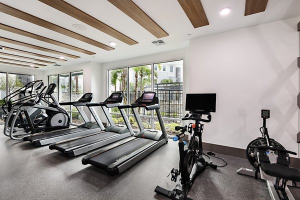 Modern fitness center with state-of-the-art equipment at Encore Metro at Millenia Apartments