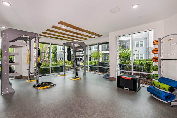 Fitness center with modern equipment at Encore Metro at Millenia Apartments