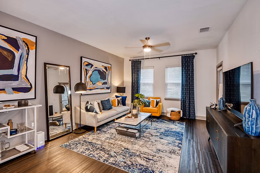 Spacious living room with modern decor at Encore Metro at Millenia Apartments