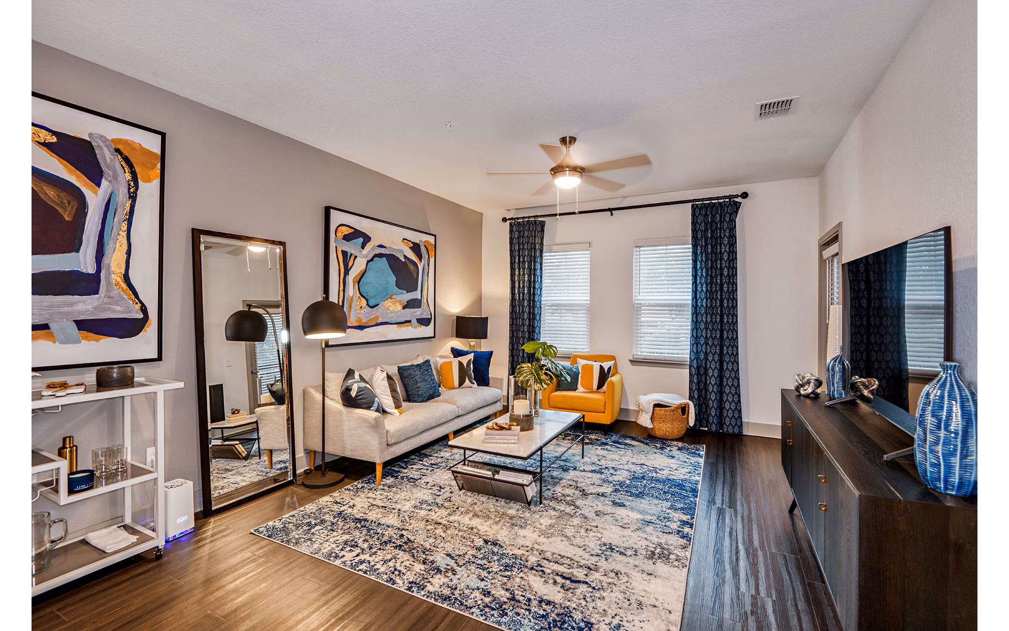 Spacious living room with modern decor at Encore Metro at Millenia Apartments