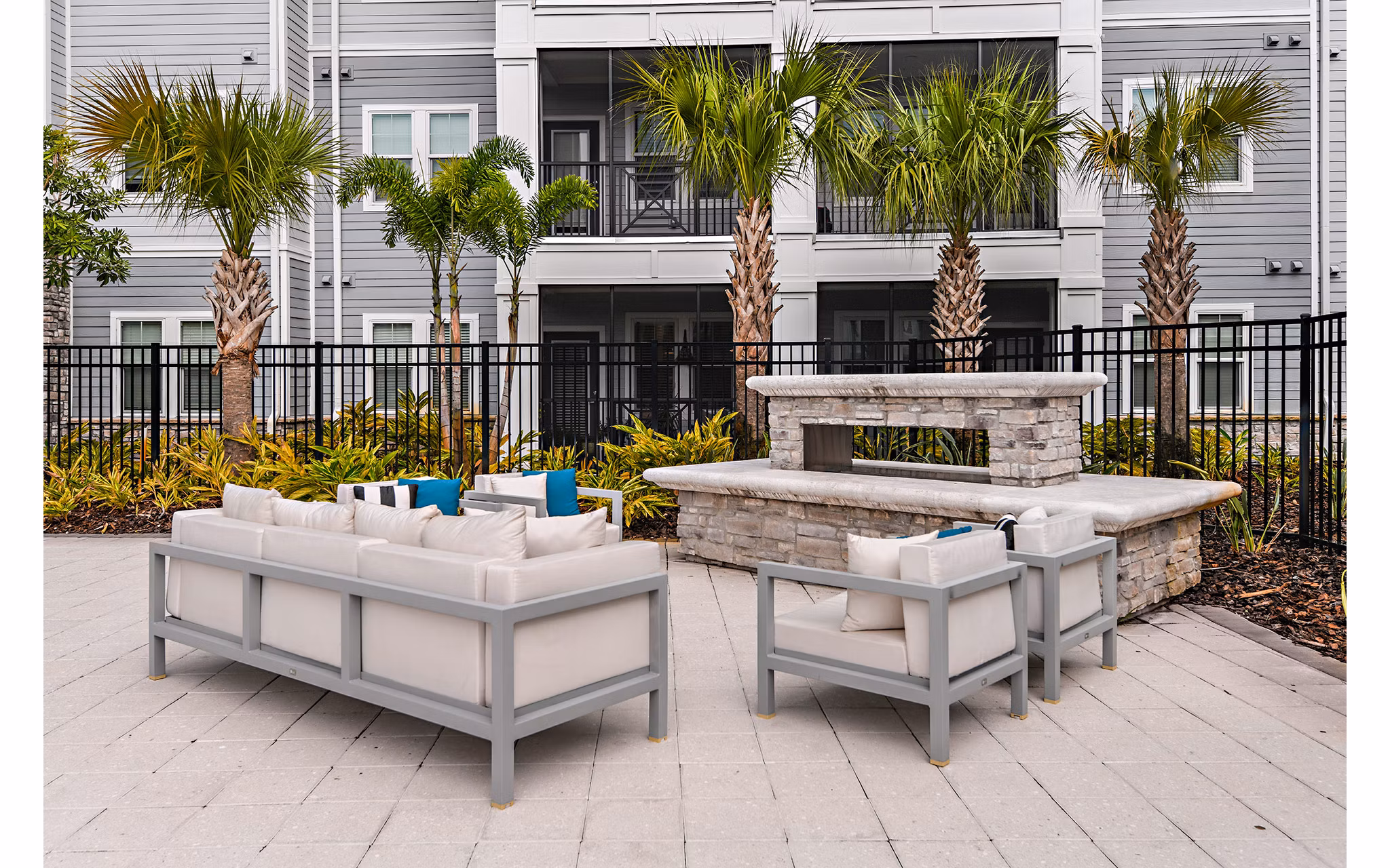 Cozy fire pit on patio at Encore Metro luxury apartments in Millenia
