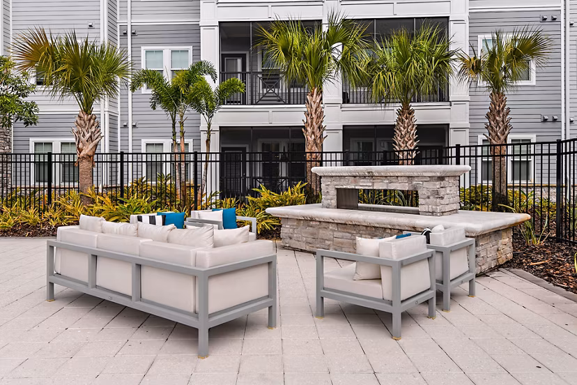 Cozy fire pit on patio at Encore Metro luxury apartments in Millenia