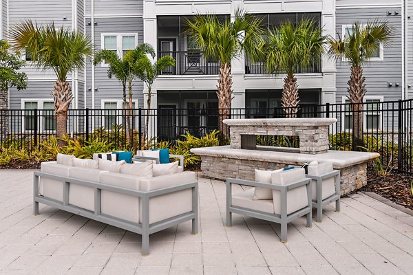 Cozy fire pit on patio at Encore Metro luxury apartments in Millenia