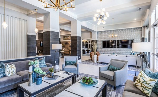Modern clubhouse with elegant seating and entertainment options at Residences at Shiloh Crossing Apartments