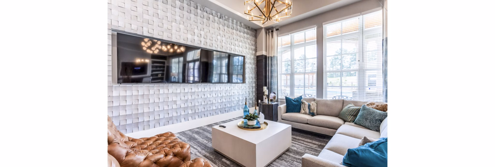 Modern clubhouse with stylish seating at Residences at Shiloh Crossing Apartments, offering luxury amenities for residents
