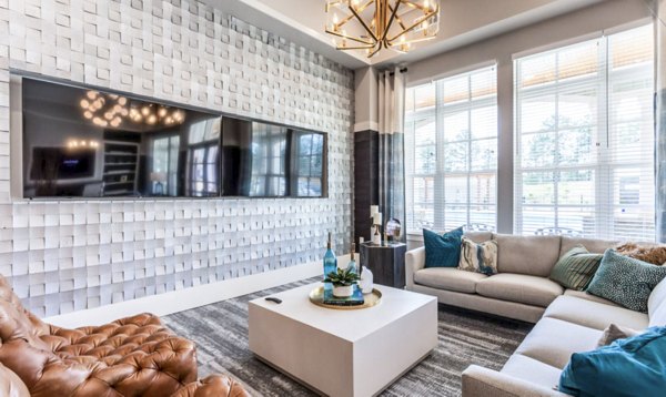 Modern clubhouse with stylish seating at Residences at Shiloh Crossing Apartments, offering luxury amenities for residents