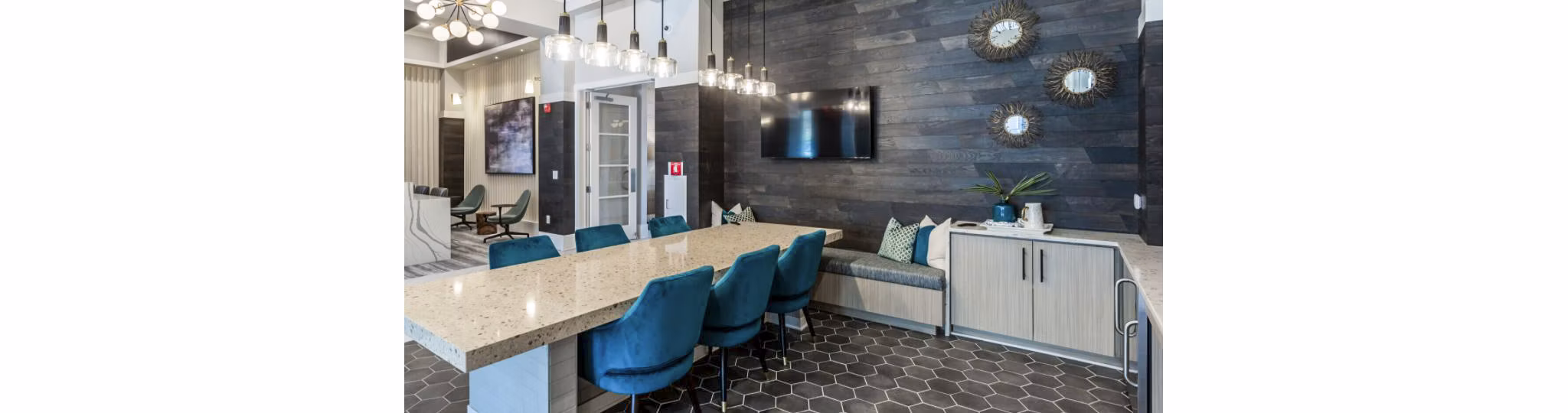 Clubhouse featuring modern lounge and gaming area at Residences at Shiloh Crossing Apartments