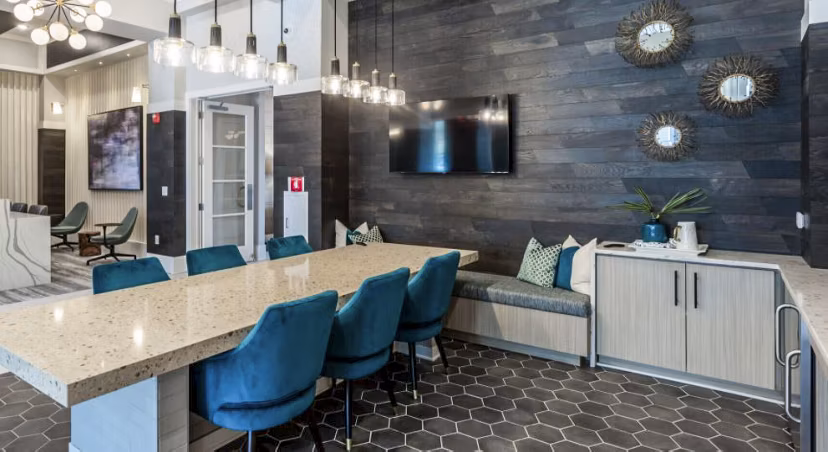 Clubhouse featuring modern lounge and gaming area at Residences at Shiloh Crossing Apartments