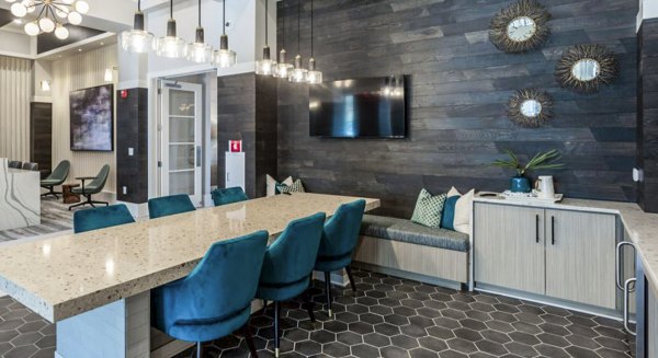 Clubhouse featuring modern lounge and gaming area at Residences at Shiloh Crossing Apartments