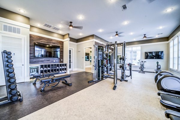 State-of-the-art fitness center with modern equipment at Residences at Shiloh Crossing Apartments for luxury living
