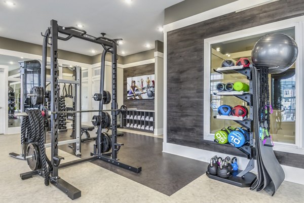 Modern fitness center with state-of-the-art equipment at Residences at Shiloh Crossing Apartments