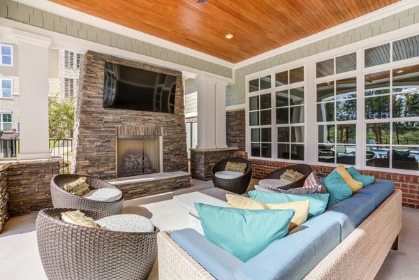 Patio with fire pit at Residences at Shiloh Crossing Apartments, offering a cozy outdoor space for relaxation and social gatherings