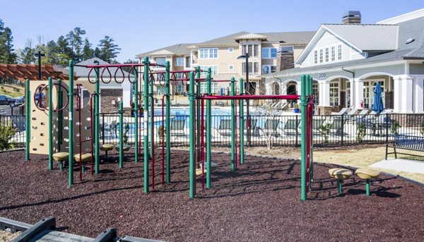 Modern playground area at Residences at Shiloh Crossing Apartments, ideal for families seeking community living amenities