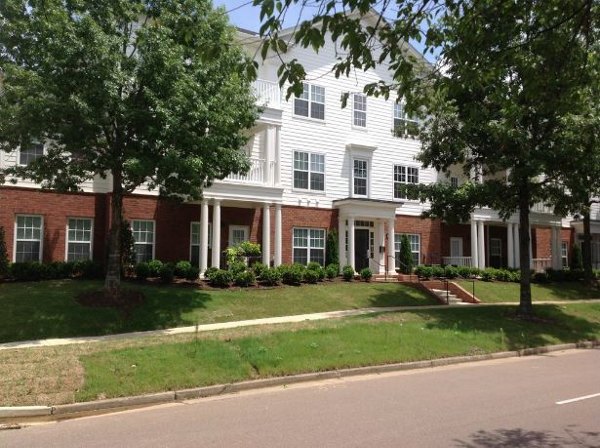Carrington at Schilling Farms: Elegant view of luxury apartments in Collierville, showcasing modern architecture and lush landscaping
