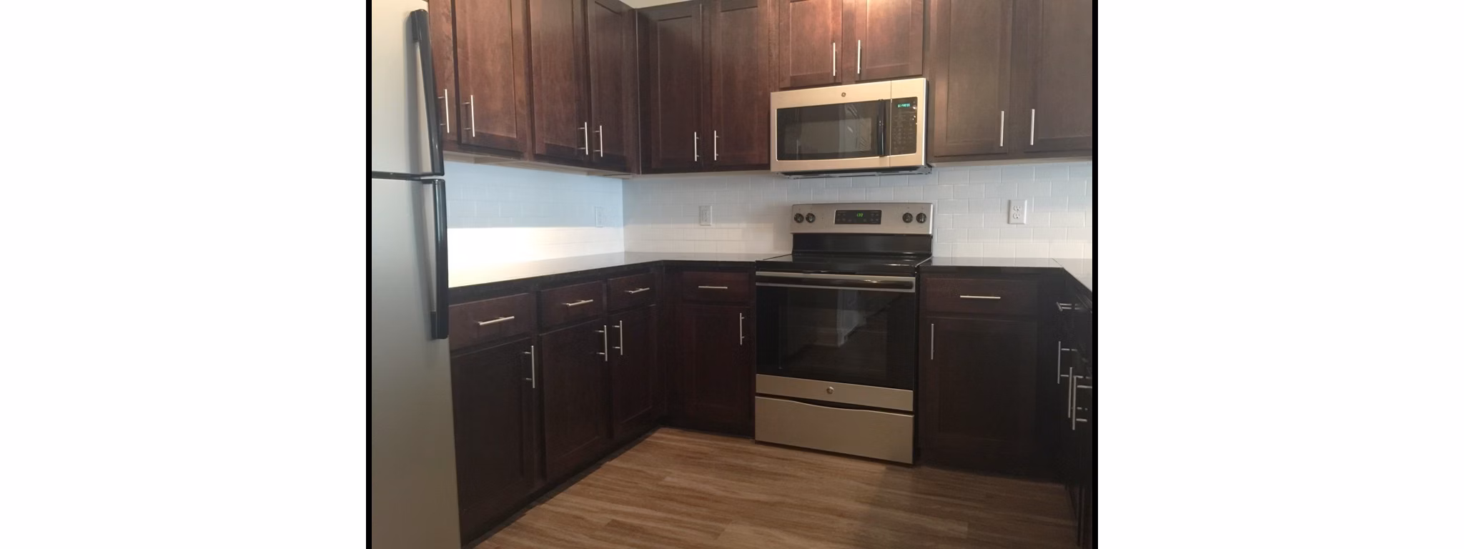 Spacious kitchen with modern appliances at Carrington at Schilling Farms Apartments