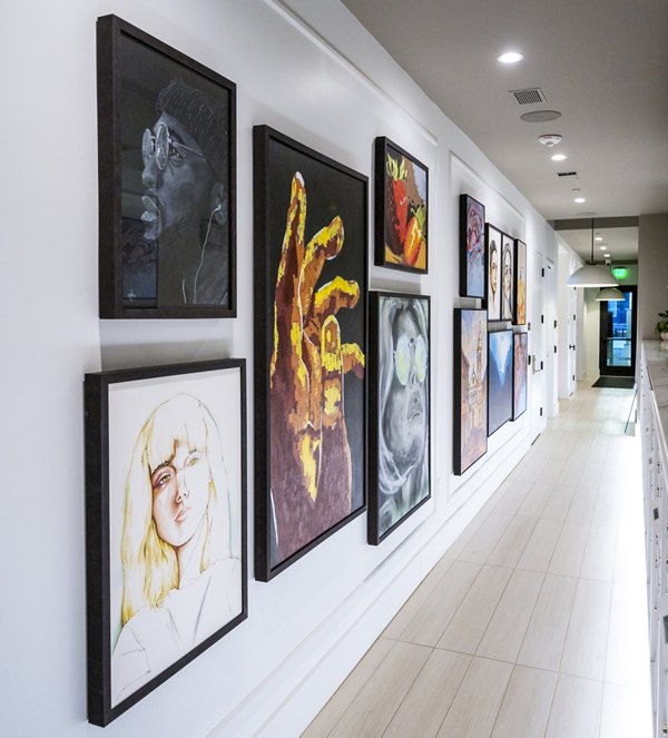 Modern clubhouse hallway with contemporary lighting at Novel Edgehill Apartments