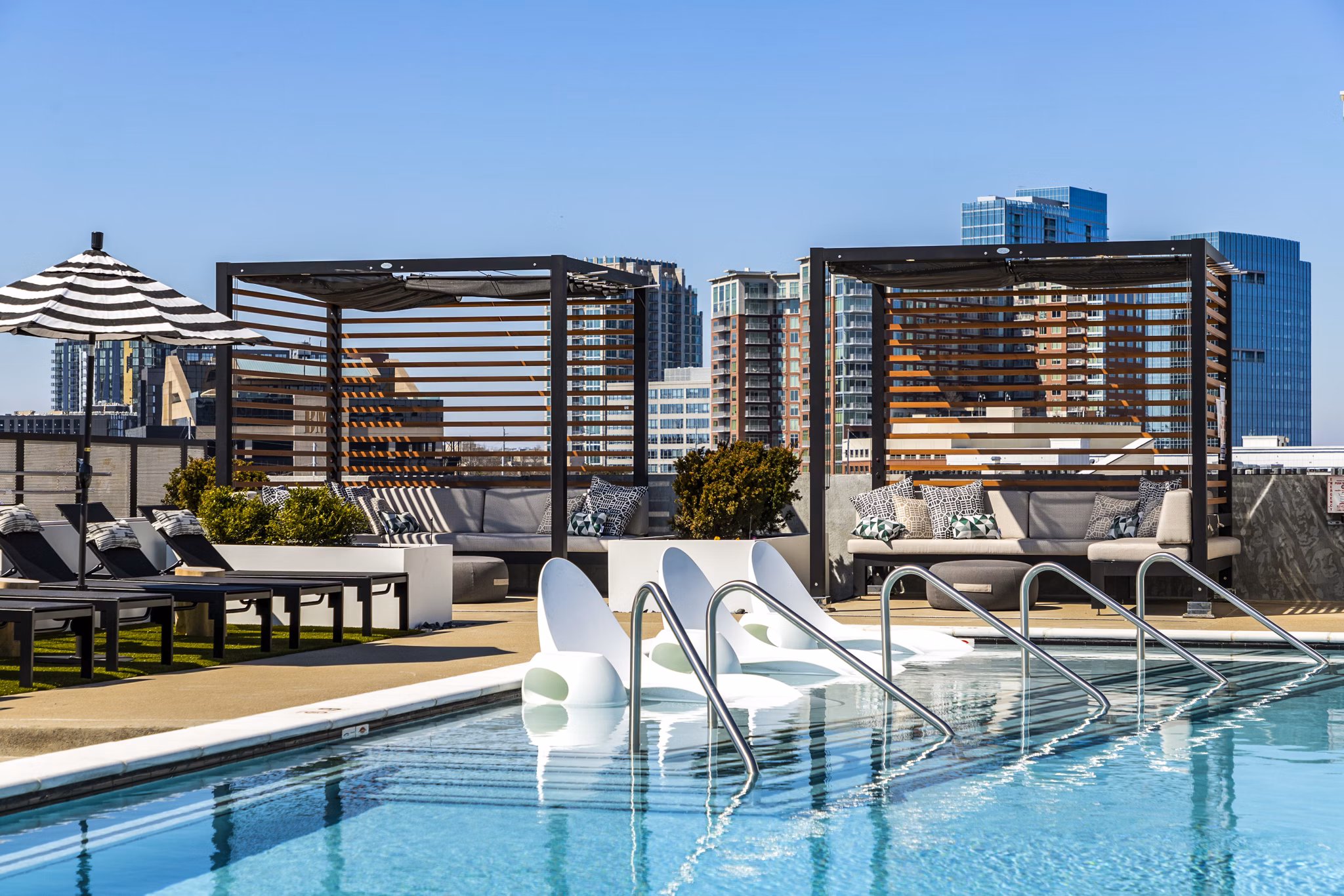 Rooftop pool with city skyline views at Novel Edgehill Apartments