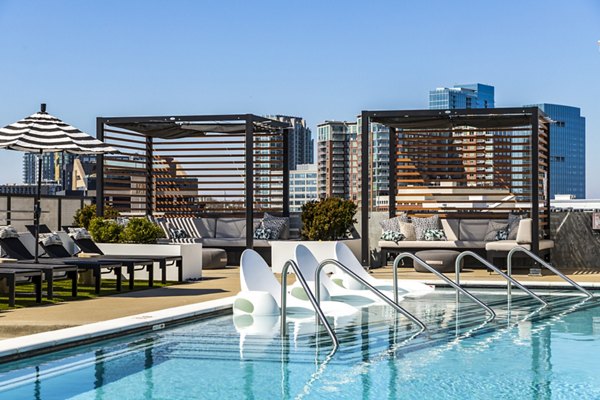 Rooftop pool with city skyline views at Novel Edgehill Apartments