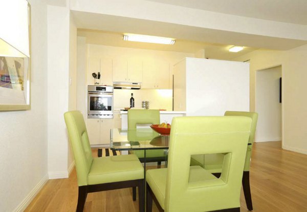 Dining area with elegant table setting at Cathedral Hill Plaza Apartments, offering luxury living in a prime location