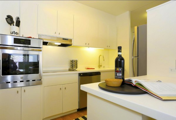 Cathedral Hill Plaza Apartments: Modern kitchen with stainless steel appliances and granite countertops