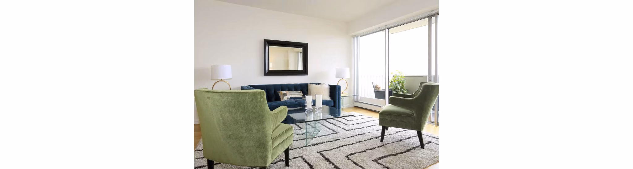Chic living room with modern decor and large windows at Cathedral Hill Plaza Apartments