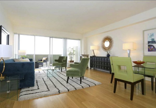 Elegant living room with modern decor and large windows in Cathedral Hill Plaza Apartments