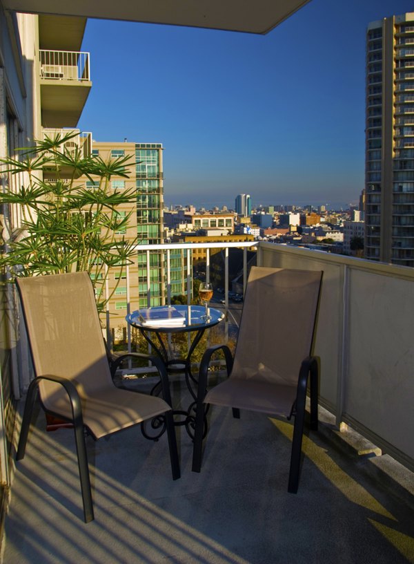 Chic patio with seating at Cathedral Hill Plaza Apartments, a luxury  property