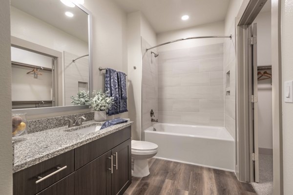 Modern bathroom featuring luxury finishes at Alexan Flower Mound Apartments