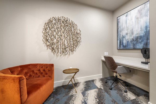 Clubhouse with modern design and seating at Alexan Flower Mound Apartments luxury community