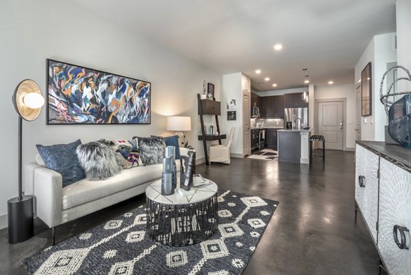 Spacious living room with modern decor at Alexan Flower Mound Apartments