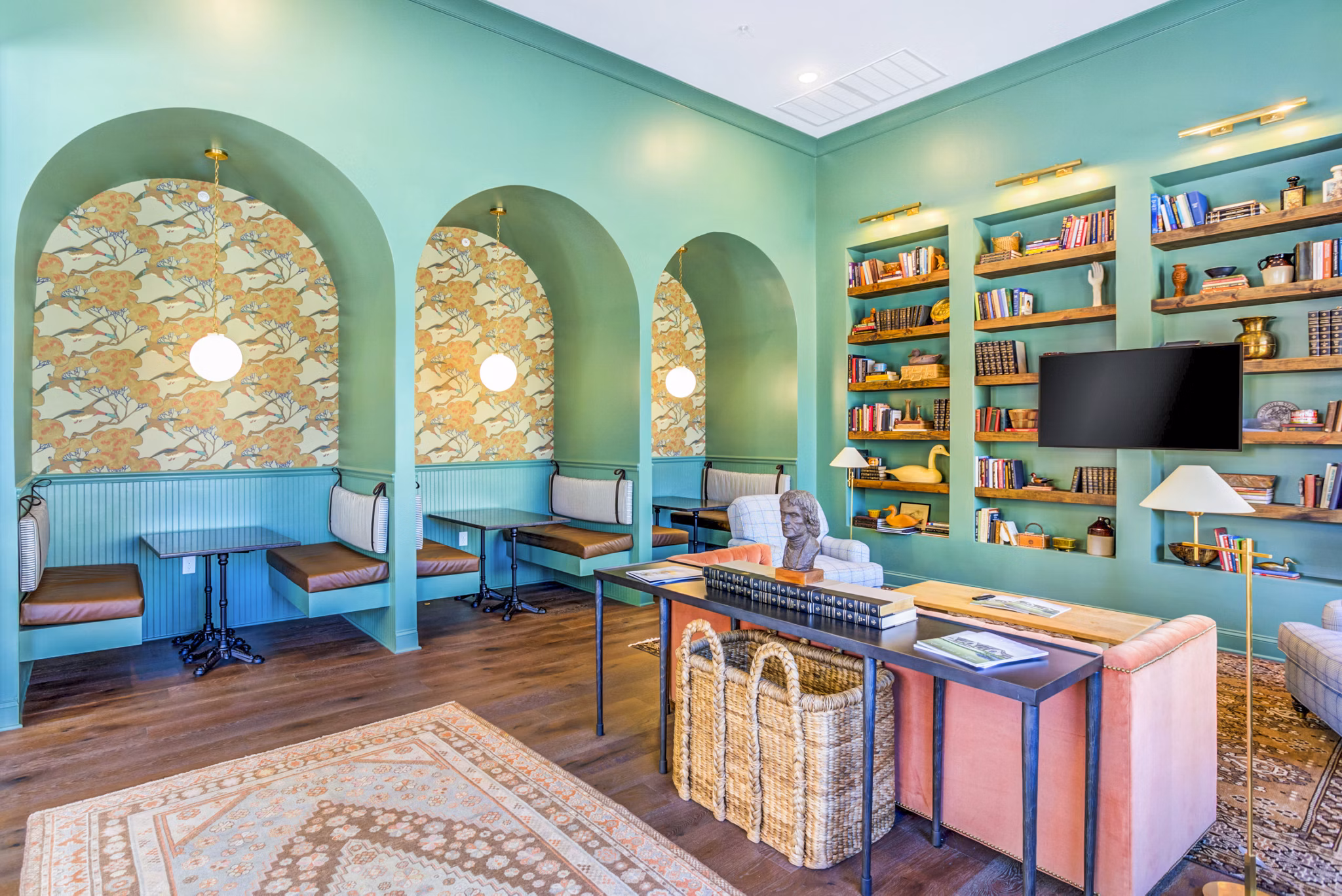 Clubhouse featuring modern design and cozy seating at Town Center at Berry Farms Apartments