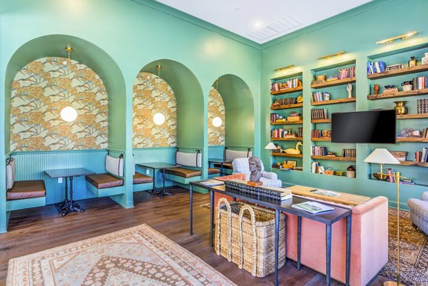 Clubhouse featuring modern design and cozy seating at Town Center at Berry Farms Apartments