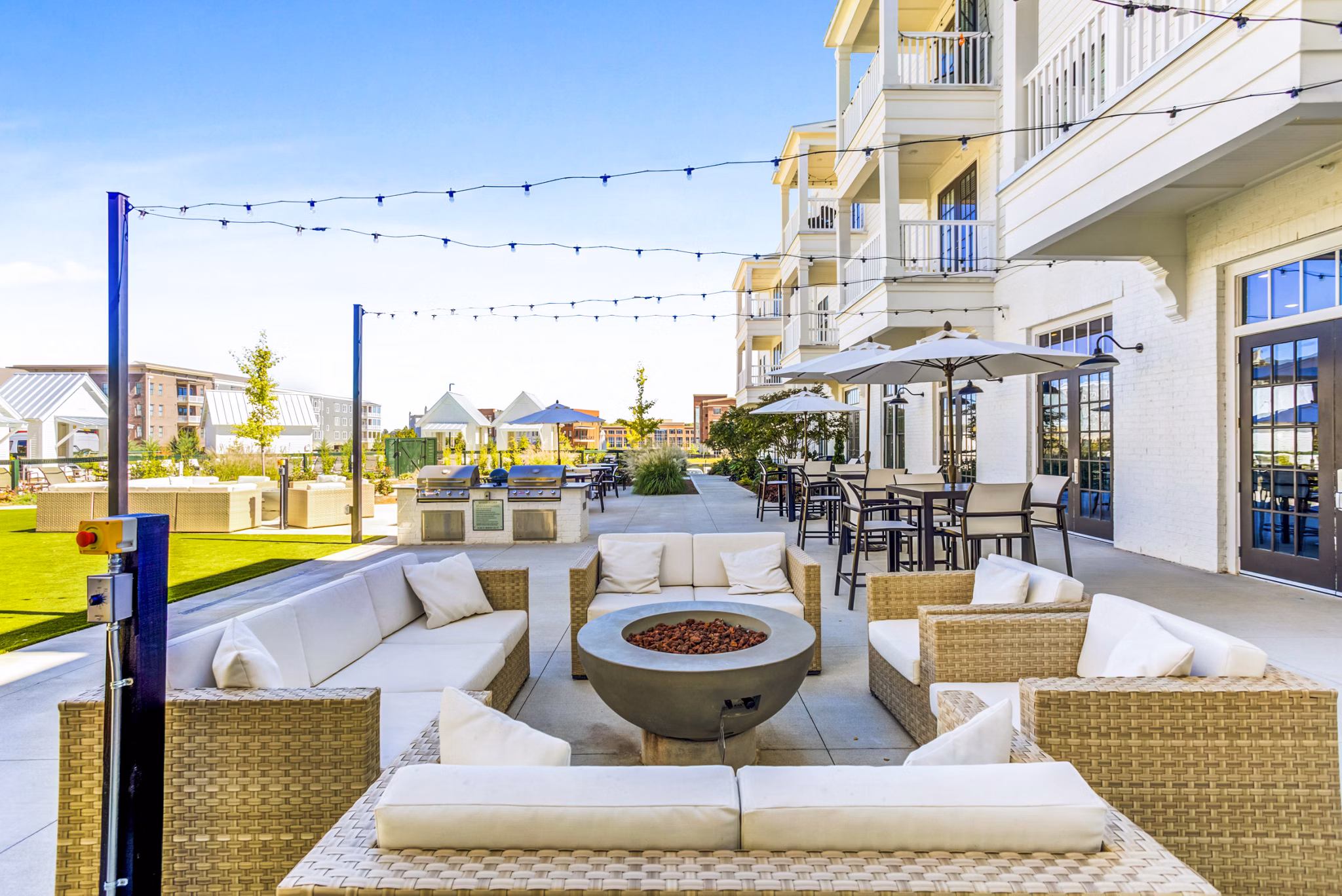 Outdoor fire pit area and patio at Town Center at Berry Farms Apartments