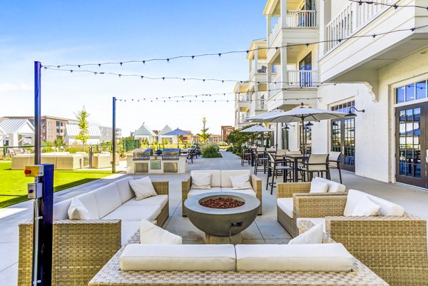 Outdoor fire pit area and patio at Town Center at Berry Farms Apartments